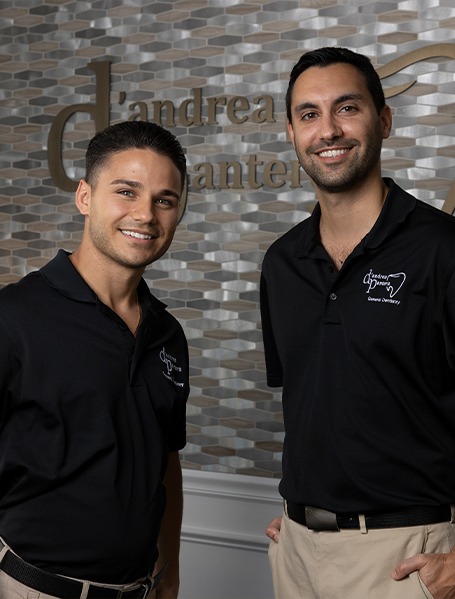 Two dentists smiling in dental office