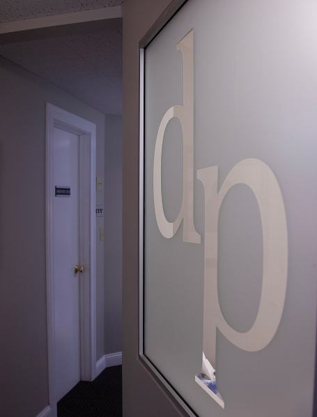 Dental office logo on wall