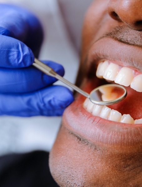 Patient receiving oral cancer screening