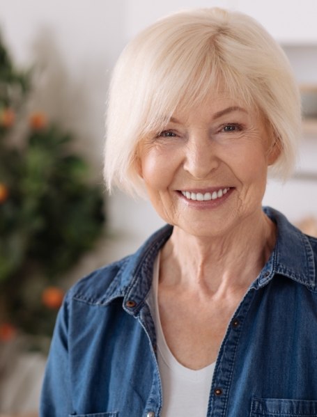 Woman with healthy smile after full mouth reconstruction