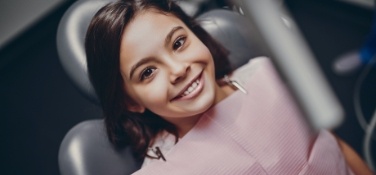 Young dental patient smiling during children's dentistry visit