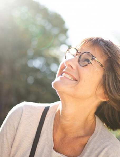 Lady smiles at the sky