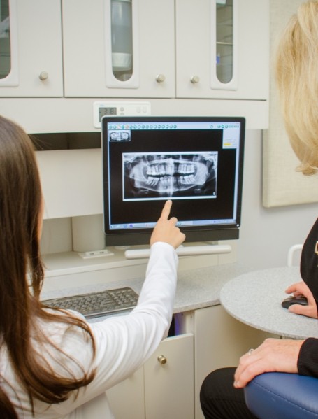 Dentist team member reviewing all digital x-rays