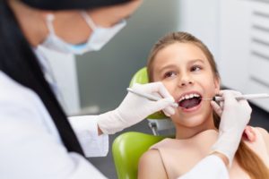 A young patient at her dental appointment.