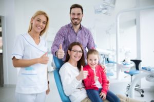 Happy family visits family dentist in Hamden 