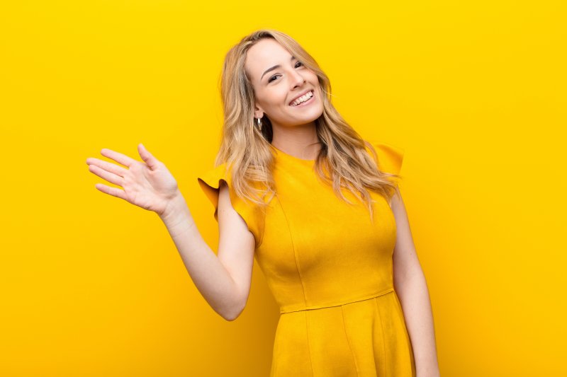 Woman smiling and waving