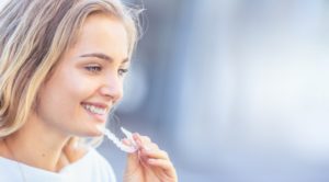 young woman wearing Invisalign in Hamden