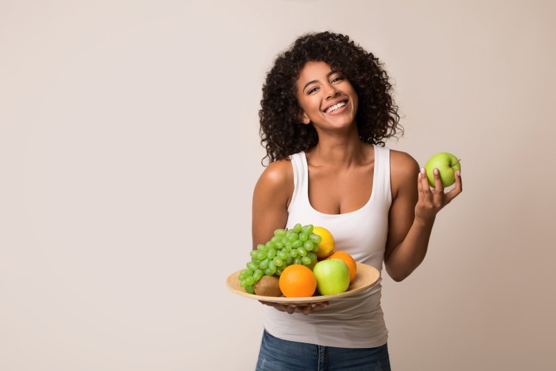 woman smiling with diet before visiting dentist in Hamden