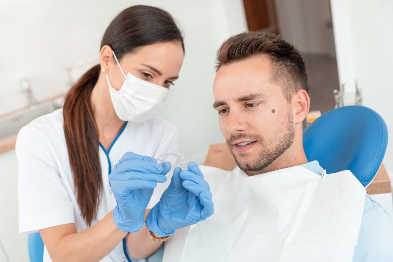 Man at dentist for Invisalign in Hamden